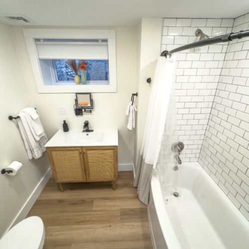 Downstairs full bathroom with tub.