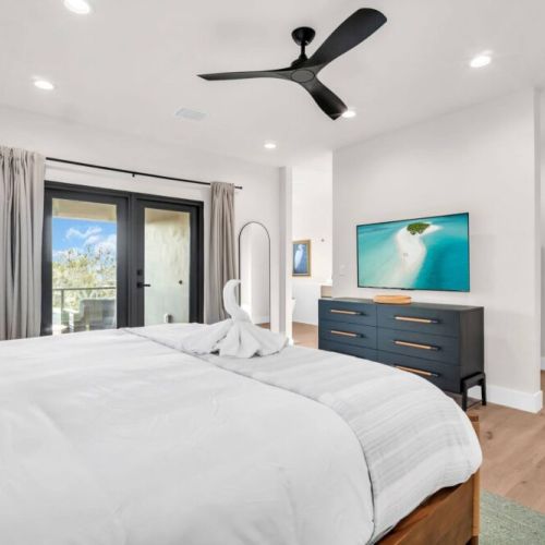 A restful retreat with plush bedding, blackout curtains, and thoughtful design elements.