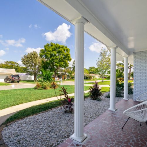 Welcoming front patio perfect for relaxing and enjoying the coastal breeze.