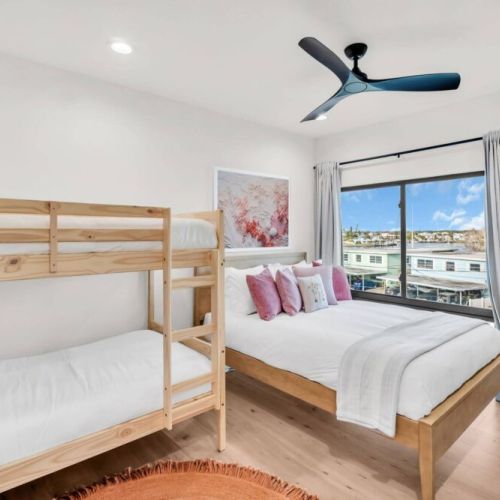 Queen bed, Twin bunk bed. Helix Mattresses , 55" TV, Dimmable Lighting, Built-in Closet, Fan, Blackout Curtains, Extension Plugs for Chargers.