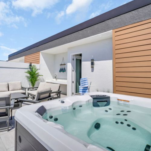 Private rooftop lounge with hot tub overlooking the ocean.