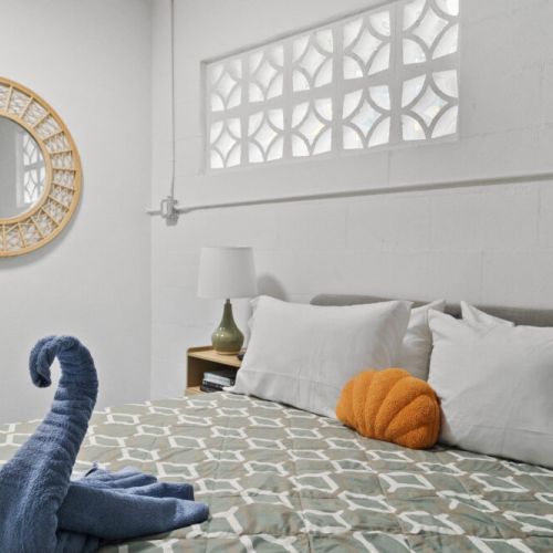 Bedroom features plush bedding and thoughtful touches for a restful stay.