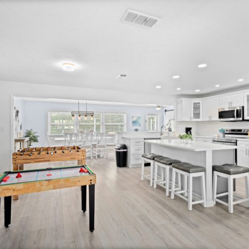 Main living area with air hockey for endless fun.