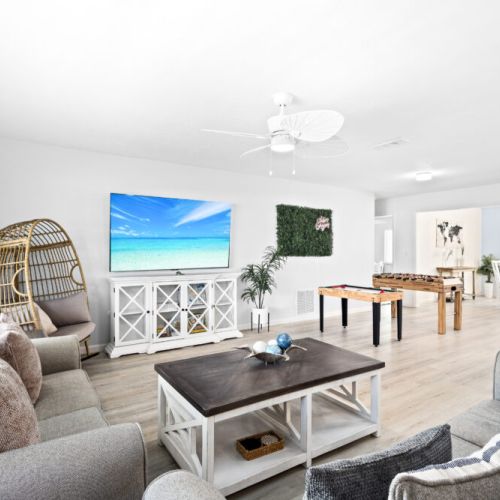 Inviting living room with cozy seating and a spacious layout, perfect for gathering and relaxing with family or friends.