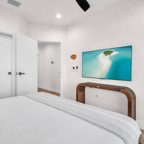 Stylish, Comfortable, Functional -King Helix Mattress, 55" TV, Dimmable Lighting, Built-in Closet, Fan, Blackout Curtains, Extension Plugs for Chargers.