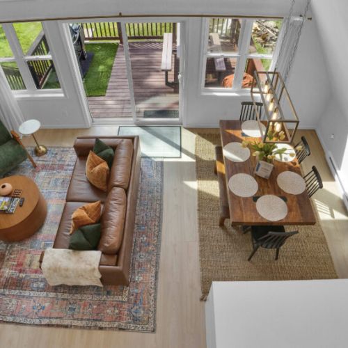 The spacious dining table comfortably accommodates large groups for meals and gatherings.