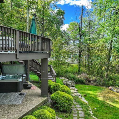 Spacious deck to cook, lounge, private hot tub area.