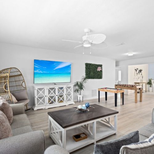 Inviting living room with cozy seating and a spacious layout, perfect for gathering and relaxing with family or friends.