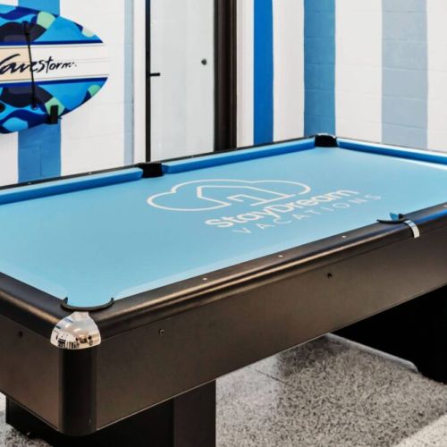 Super fun game room featuring a pool table. Paddle board and cart for the beach. And more.