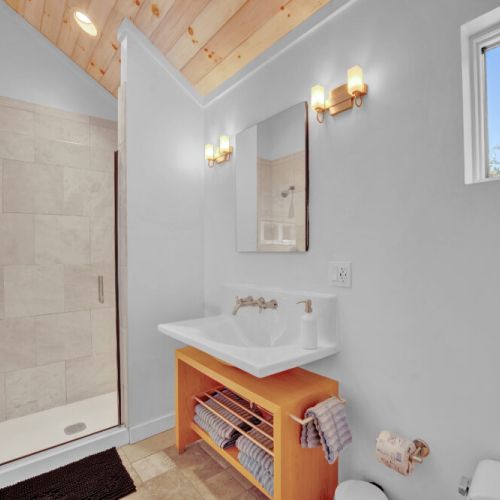 Primary bathroom - dual shower heads, bathroom heat, fan.