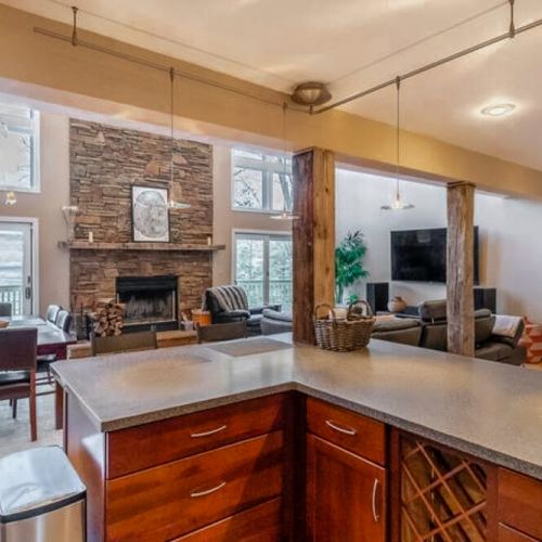 Enjoy views of the lake and TV while preparing a meal.