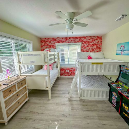 Bunk room with arcade and tv.