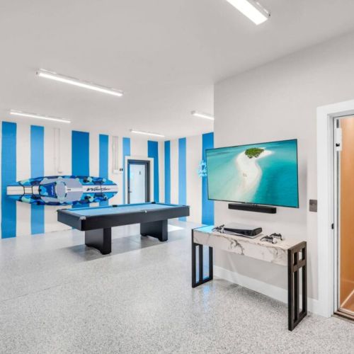 Ultimate game room. Pool table, Play Station, Basketball, Darts, Magnetic Board Games, Roku TV and a Sonos Sound System! Elevator access for all 3 floors.