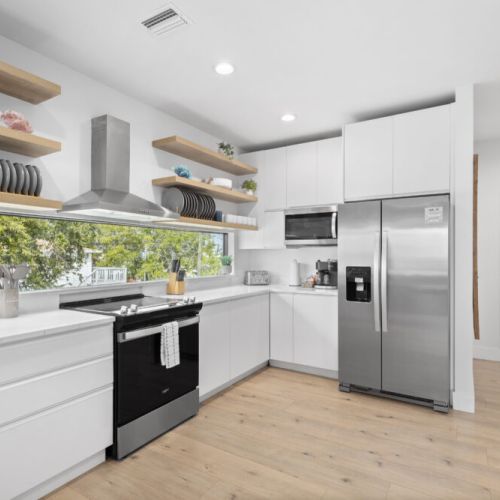 Cook up delicious meals and enjoy memorable moments in this bright, modern kitchen, designed for effortless entertaining and relaxing with loved ones during your stay.