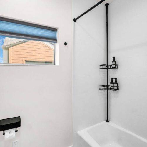 Bath tub - Third floor bathroom features a shower/tub combo added a grab bar by the tub after photo.