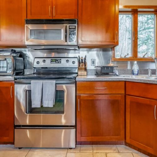 Kitchen range, microwave and toaster oven.
