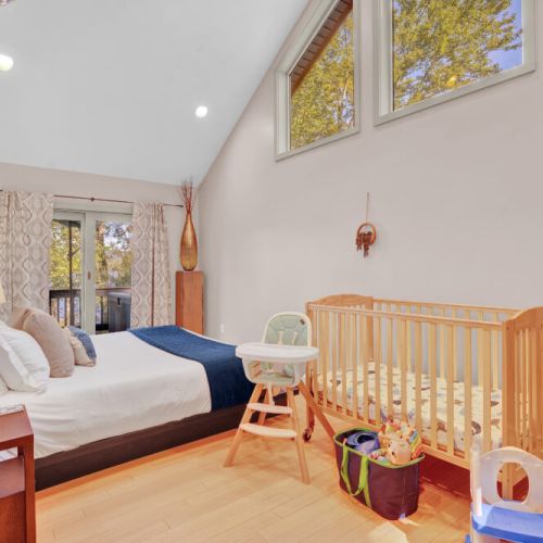 High window is perfect for lying in bed watching stars by night and eagles soaring by day. Crib, High Chair, toys, books, kids potty, (baby bath, baby gates, fireplace gate not pictured)