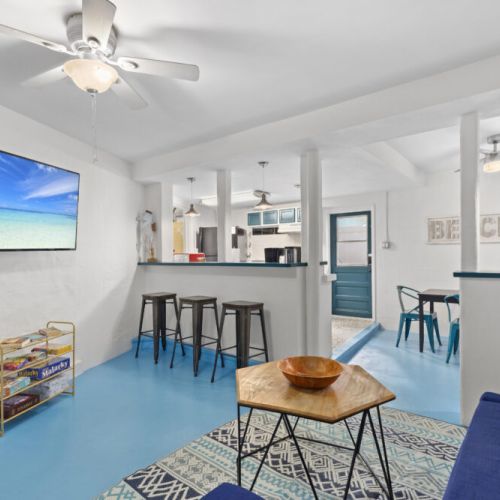 Open-concept living and dining area offering plenty of space to gather, relax, and enjoy meals together in coastal comfort.