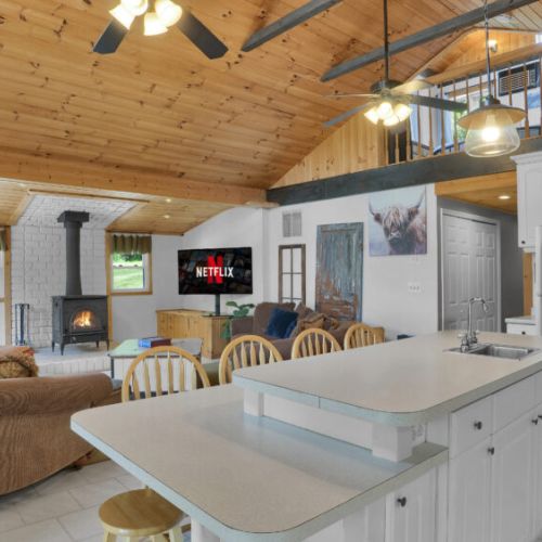 The heart of the home—an inviting open kitchen and living area designed for connection, complete with cozy seating and plenty of space to relax.