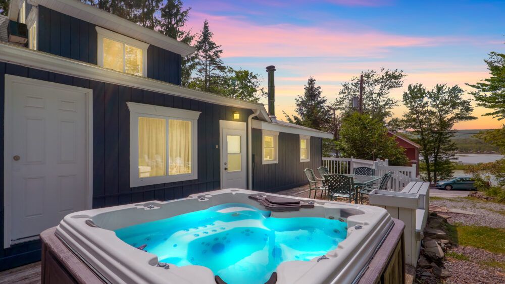Soak in the hot tub while enjoying a very pleasant view.