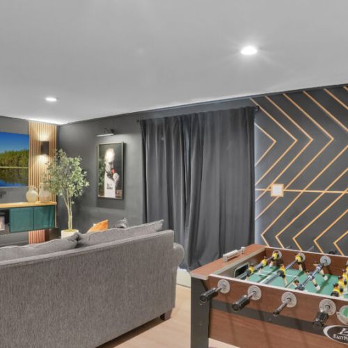 Relax in the cozy game room, a perfect spot for lounging and entertainment.