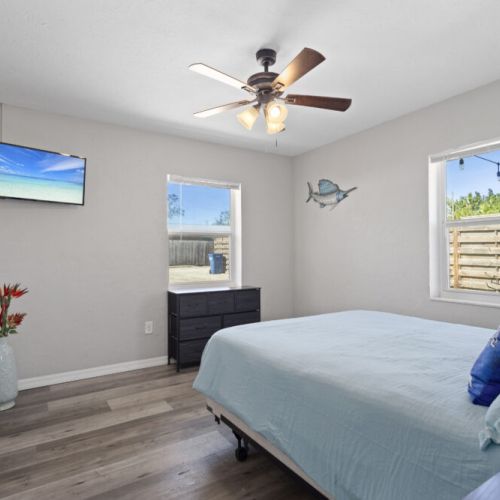Queen bedroom with tv.
