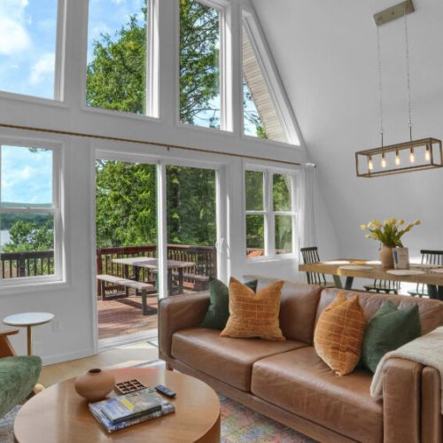 Enjoy breathtaking lake views from the spacious living room with vaulted ceilings.