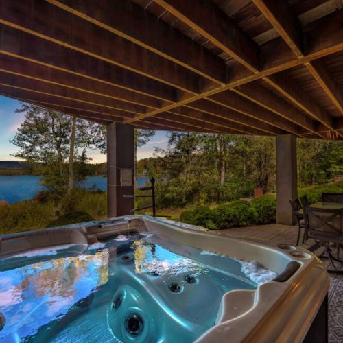 Unwind in the hot tub while enjoying the beautiful sunsets over the lake directly in front of you.
