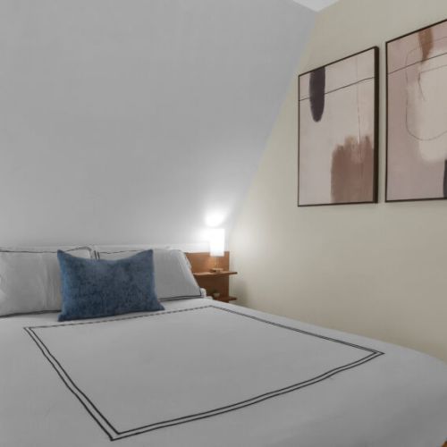 Unwind in this cozy queen bed. Perfect for vacation naps and getting a good nights rest. Night lights for reading.