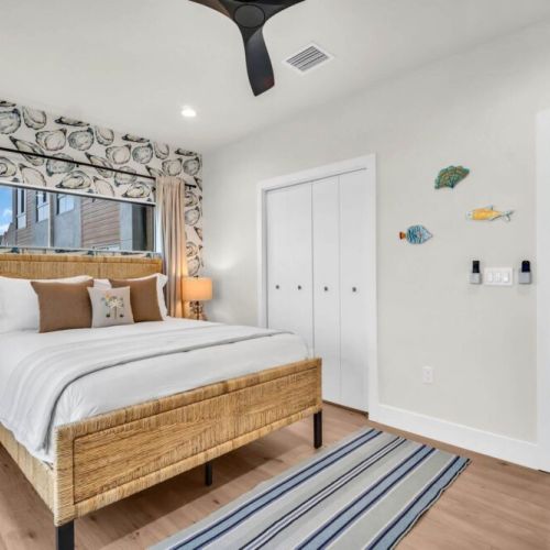 Where restful nights make for amazing days — book today and snooze in style. The main floor bedroom is a haven featuring a queen bed with luxurious bedding, ample closet space, mounted tv, full length mirror and private balcony.