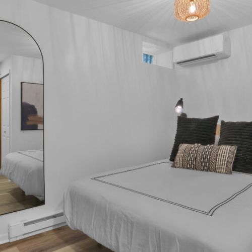 Cozy and Modern Queen Bedroom. Located in the basement.