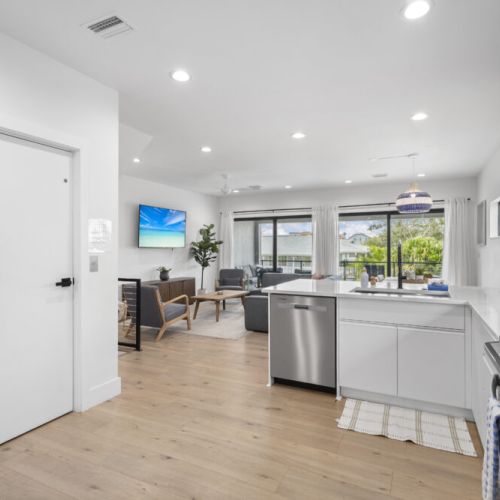 An inviting open-concept space where the kitchen and living area flow seamlessly for cooking, dining, and relaxing together.