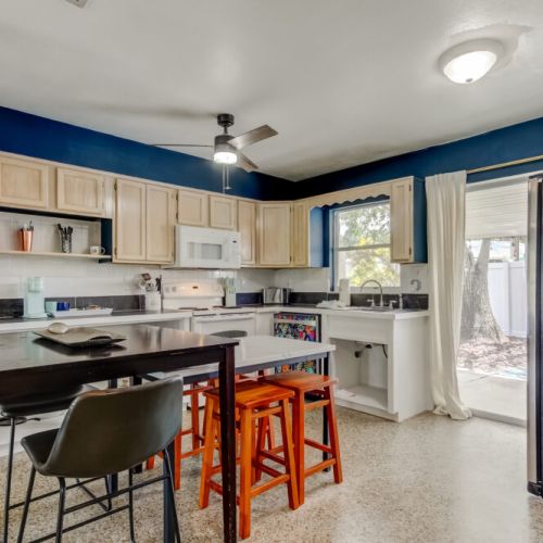 Open kitchen, lots of natural light, dining table