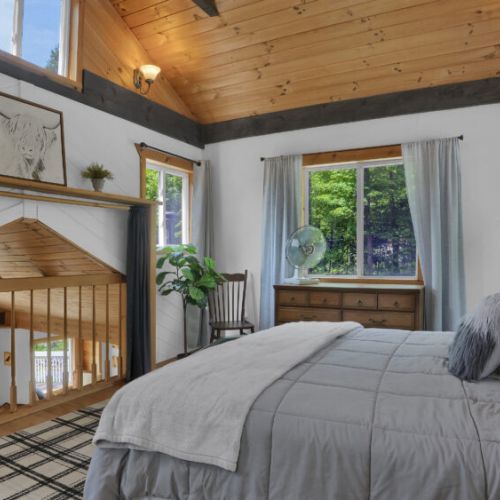 Wake up to nature. Every bedroom features large windows that frame the beautiful forest views, filling the space with warm, natural light.