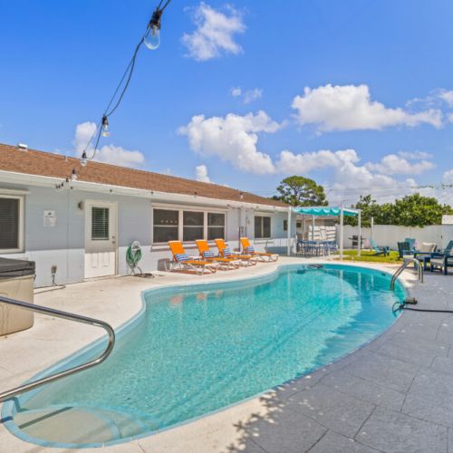 Enjoy the backyard retreat with a sparkling pool and relaxing hot tub.