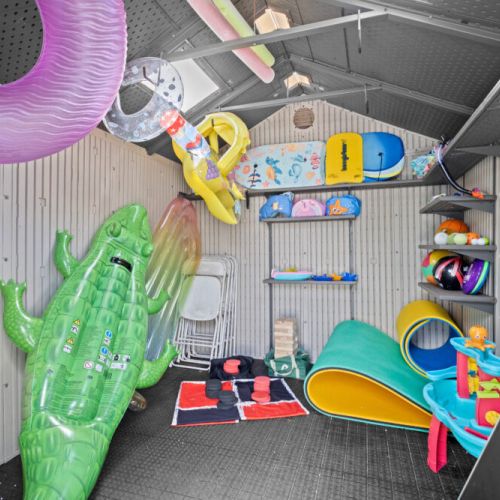 Shed stocked with pool toys, games, and floats, perfect for fun-filled days by the water.