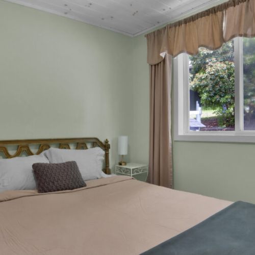 Bringing the outdoors in! Enjoy stunning views of the surrounding greenery from the comfort of your bed.