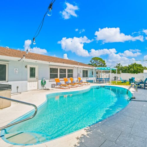 Enjoy the backyard retreat with a sparkling pool and relaxing hot tub.