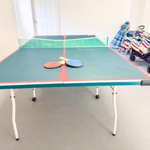 Ping Pong Game Room is right by the pool area. There are other fun outdoor games included too. There is a lot of beach gear (pictured in the back).