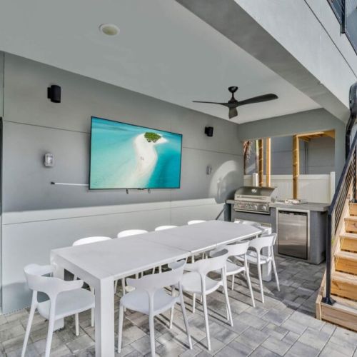 Fire up the grill, gather with friends, and enjoy al fresco dining at its finest. Turn on the 75" tv and listen to your favorite music or throw on the game! Or enjoy movie night from the pool!