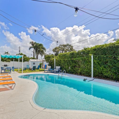 Sparkling backyard pool inviting you to swim, relax, and soak up the sun.