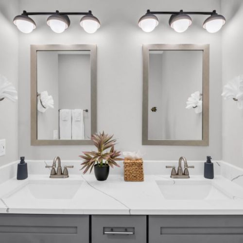 Queen Shell Room Ensuite Bathroom. Dual sinks and walk-in shower.