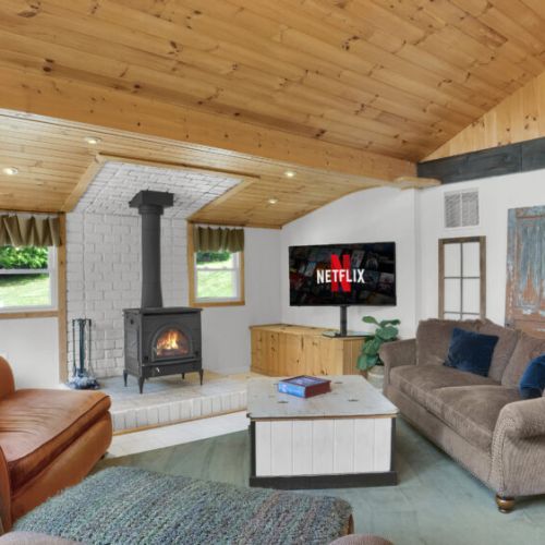 The perfect spot for chilly afternoons: cozy up by the fire with your favorite book and take in the beautiful nature views.