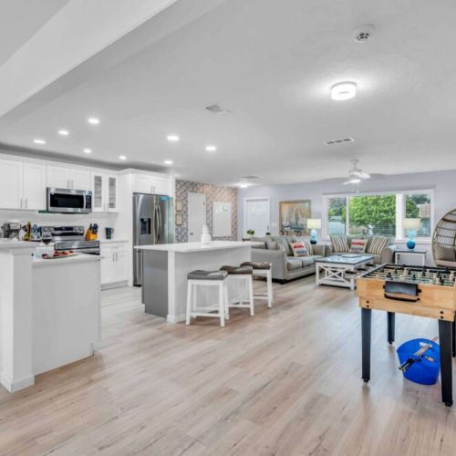 Spacious Living Area: Bright, open layout with fun foosball and inviting views—perfect for gatherings!