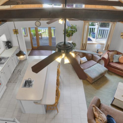 A bird's-eye view of the cozy living room from this inviting loft.