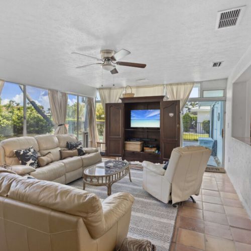 Florida room, ready for you to relax and enjoy the views of the back yard.