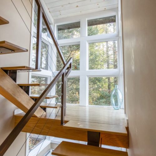 Custom staircase with side front and back facing views.