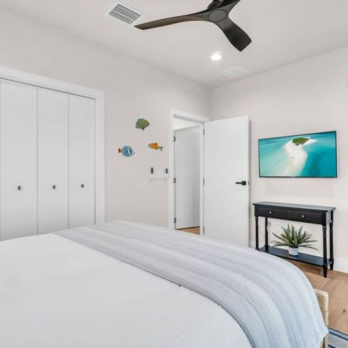 Queen bedroom on the main floor with its own balcony! Tv, fan, black out curtains, Helix mattress.