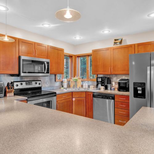 Fully Stocked Kitchen with Stainless Steel appliances. Refrigerator, Oven, Dishwasher, Microwave, Coffee Maker, Toaster Oven, Ice Machine.