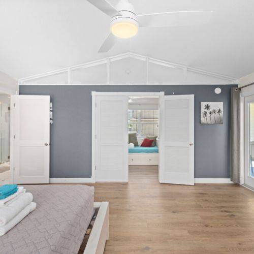 Connected to the ensuite bathroom, kind day bed room, and outside breezeway leading to the other house as well as the lanai with the pool.
